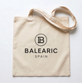 Beige tote bag with 'Balearic Spain' logo on a white background