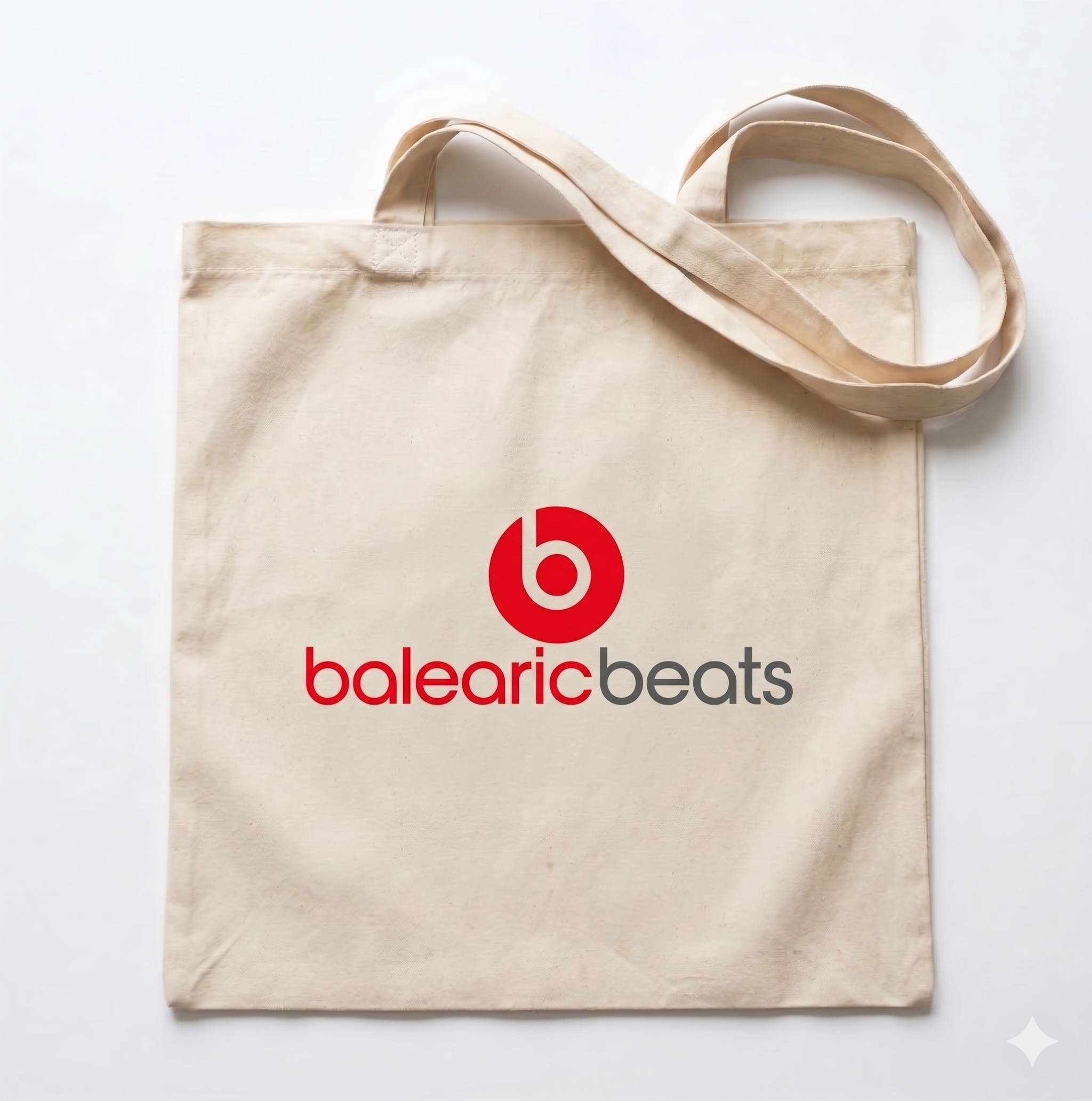 Beige tote bag with 'balearic beats' logo on a white background
