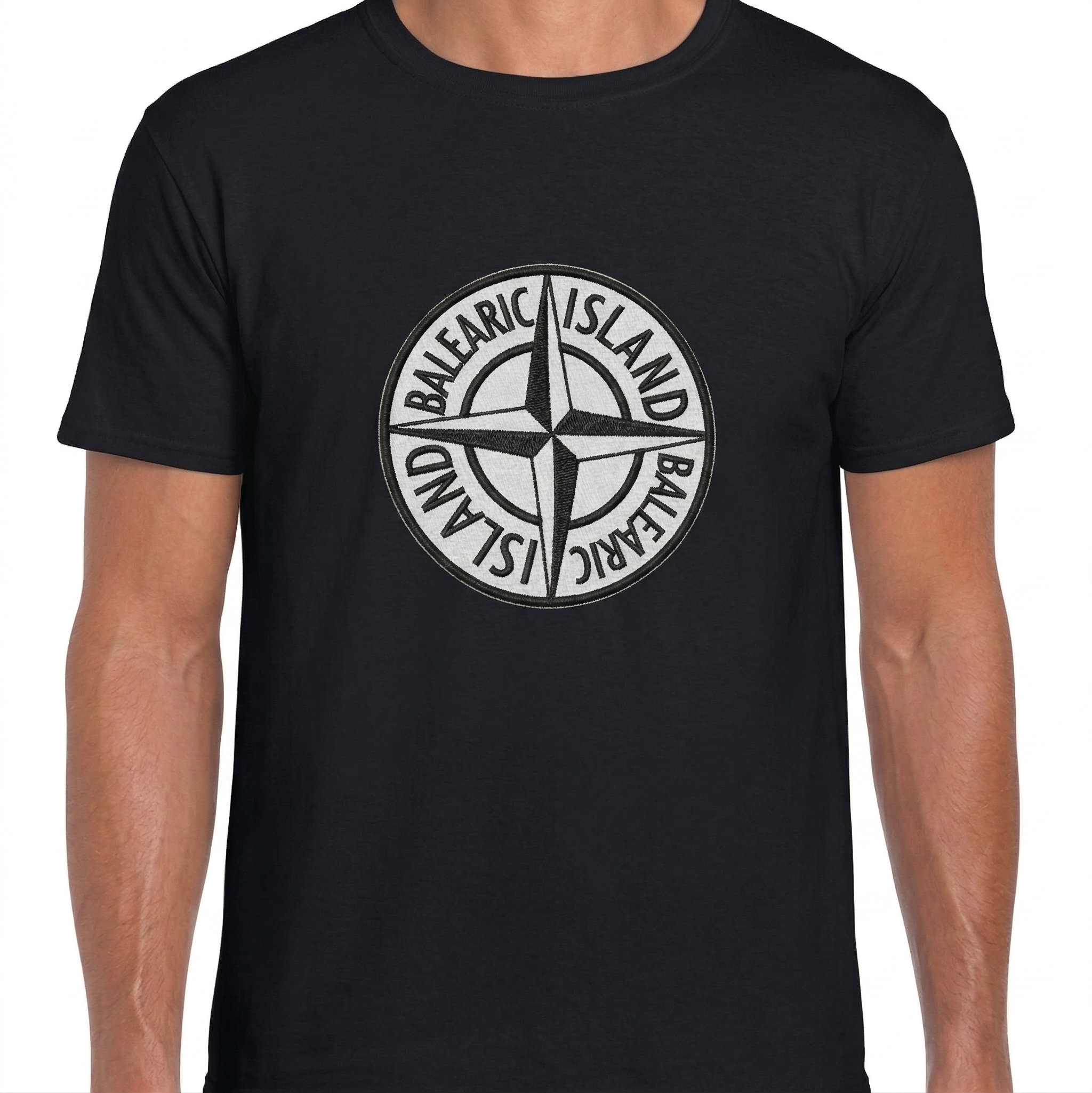 Balearic Blend T-shirt: Model wearing a black tee with a white and black Balearic Island compass badge graphic.