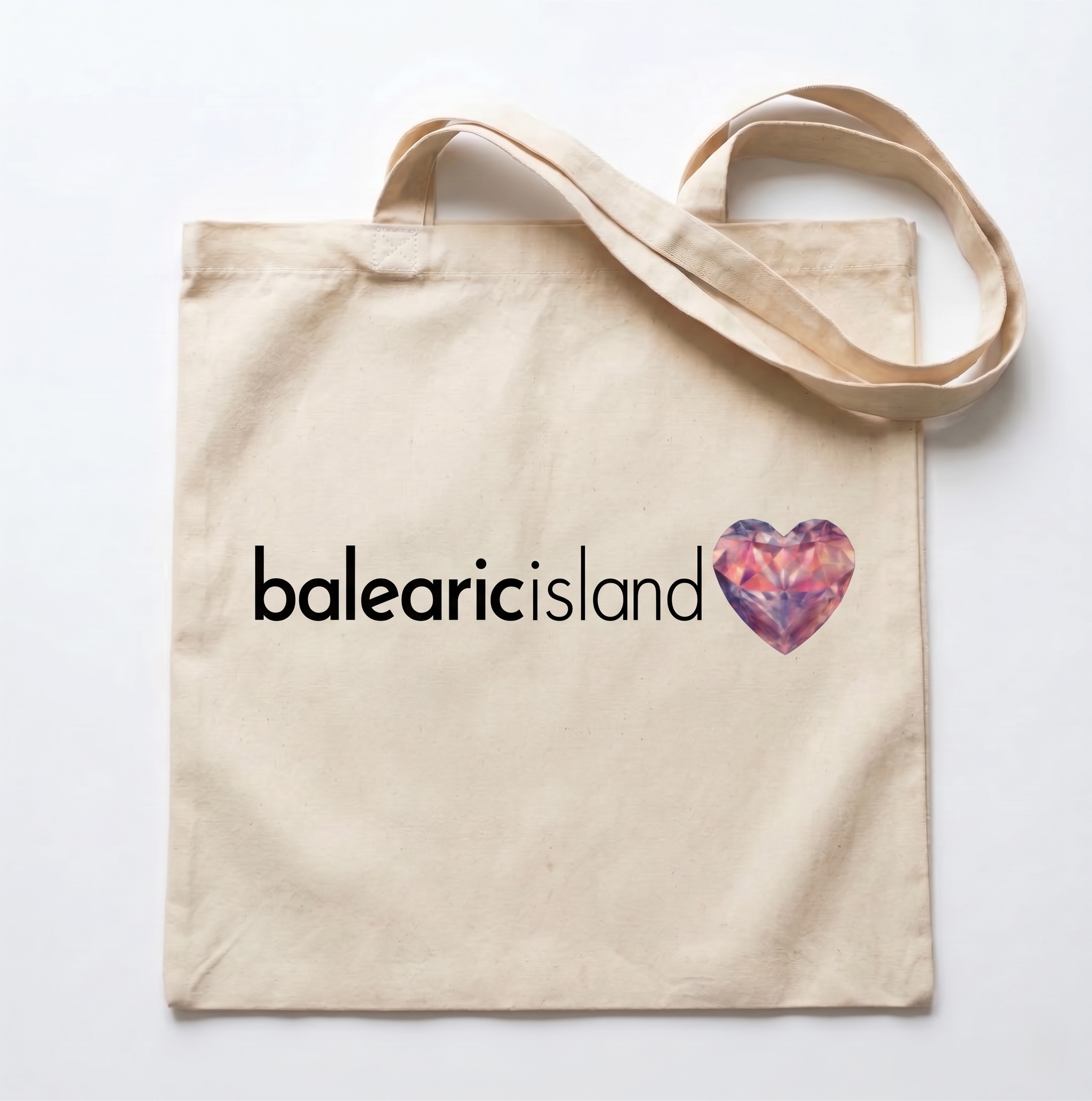 Beige tote bag with 'balearic island' text and a heart design on a white background